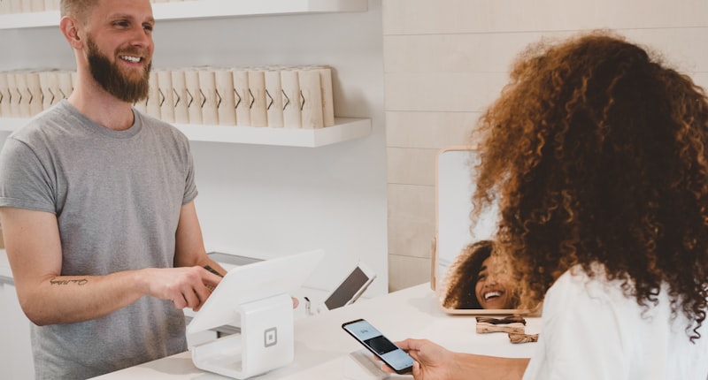 Business owner reviewing positive customer testimonials and reviews on a laptop screen
